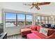 Living room with water views, comfortable seating and hardwood floors at 5200 Brittany S Dr # 1110, St Petersburg, FL 33715