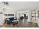 Living room with hardwood floors, mirrored wall, and comfortable seating at 5200 Brittany S Dr # 1110, St Petersburg, FL 33715