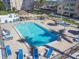 Relaxing pool area with multiple lounge chairs and shade structures at 5200 Brittany S Dr # 1110, St Petersburg, FL 33715