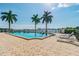 Inviting community pool with patio and waterfront views at 5200 Brittany S Dr # 1110, St Petersburg, FL 33715