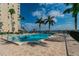 Refreshing community pool with lounge chairs and waterfront views at 5200 Brittany S Dr # 1110, St Petersburg, FL 33715