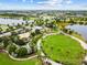 Aerial view of a community with parks, lakes, and playground at 5418 Wayfarer Ave, Apollo Beach, FL 33572