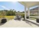 Spacious backyard with grassy area, privacy fence and covered patio at 5418 Wayfarer Ave, Apollo Beach, FL 33572