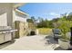 Covered patio with built-in storage and grill at 5418 Wayfarer Ave, Apollo Beach, FL 33572