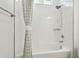 Simple bathroom with a shower/tub combo and white tile at 5418 Wayfarer Ave, Apollo Beach, FL 33572