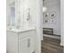 Modern bathroom with white vanity and entry to another room at 5418 Wayfarer Ave, Apollo Beach, FL 33572