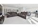 Spacious bonus room with two reclining sofas and built-in shelving at 5418 Wayfarer Ave, Apollo Beach, FL 33572
