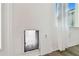 Interior pet door installed in white wall at 5418 Wayfarer Ave, Apollo Beach, FL 33572