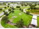 Dog park with agility equipment and shaded seating areas at 5418 Wayfarer Ave, Apollo Beach, FL 33572