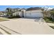 Two-story house with a three-car garage and driveway at 5418 Wayfarer Ave, Apollo Beach, FL 33572