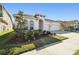 Two-story house with a three-car garage and front yard at 5418 Wayfarer Ave, Apollo Beach, FL 33572