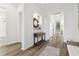Bright foyer with wood floors and built-in shelving at 5418 Wayfarer Ave, Apollo Beach, FL 33572