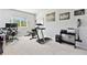 Home gym with treadmill, weight bench, and ample floor space at 5418 Wayfarer Ave, Apollo Beach, FL 33572