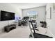 Home gym featuring a standing desk, treadmill, and weight equipment at 5418 Wayfarer Ave, Apollo Beach, FL 33572