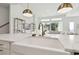 Kitchen island with farmhouse sink and modern faucet at 5418 Wayfarer Ave, Apollo Beach, FL 33572