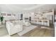 Open living space with large sectional sofa and kitchen views at 5418 Wayfarer Ave, Apollo Beach, FL 33572