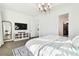 Main bedroom with king bed, TV, and access to walk-in closet at 5418 Wayfarer Ave, Apollo Beach, FL 33572