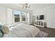 Main bedroom with king bed, and large windows with natural light at 5418 Wayfarer Ave, Apollo Beach, FL 33572