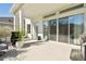 Outdoor patio with seating area, grill, and sliding glass doors at 5418 Wayfarer Ave, Apollo Beach, FL 33572