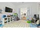 Playroom with view into kitchen and colorful play area at 5418 Wayfarer Ave, Apollo Beach, FL 33572
