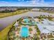 Community pool with lap lanes, a leisure pool, and a cabana at 5418 Wayfarer Ave, Apollo Beach, FL 33572