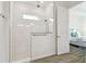 Walk-in shower with marble tile and glass enclosure at 5418 Wayfarer Ave, Apollo Beach, FL 33572