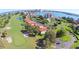 Aerial view of community with golf course and waterfront at 6104 Palma Del Mar S Blvd # 104, St Petersburg, FL 33715