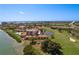 Aerial view showcasing community near golf course and water at 6104 Palma Del Mar S Blvd # 104, St Petersburg, FL 33715