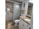 Updated bathroom with a walk-in shower, granite vanity, and tiled floors at 6104 Palma Del Mar S Blvd # 104, St Petersburg, FL 33715