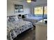Bedroom with two double beds featuring a coastal decor and water views at 6104 Palma Del Mar S Blvd # 104, St Petersburg, FL 33715