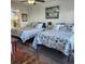 Guest bedroom with two double beds and coastal decor at 6104 Palma Del Mar S Blvd # 104, St Petersburg, FL 33715