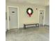 Community hallway with restrooms and seating at 6104 Palma Del Mar S Blvd # 104, St Petersburg, FL 33715