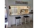 Kitchen with granite countertops and white cabinets, offering a breakfast bar with seating at 6104 Palma Del Mar S Blvd # 104, St Petersburg, FL 33715