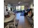 Bright living room with comfy seating, and sliding glass doors leading to a patio at 6104 Palma Del Mar S Blvd # 104, St Petersburg, FL 33715