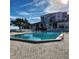 Community pool with ample deck space for lounging at 6104 Palma Del Mar S Blvd # 104, St Petersburg, FL 33715