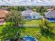 Aerial view of house and backyard with pond at 6610 Carrington Sky Dr, Apollo Beach, FL 33572