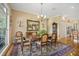 Elegant dining room with ornate furniture and large windows at 7807 Bay Dr, Tampa, FL 33635