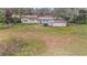 House with a large backyard and mature trees at 10809 Bartolotti Loop, Seffner, FL 33584
