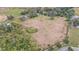 Large lot with mature trees and nearby buildings at 10809 Bartolotti Loop, Seffner, FL 33584