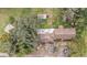House with damaged roof and surrounding trees at 10809 Bartolotti Loop, Seffner, FL 33584
