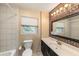 Clean bathroom with mosaic tile accents and updated vanity at 10809 Bartolotti Loop, Seffner, FL 33584