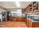 Updated kitchen with stainless steel appliances and wood flooring at 10809 Bartolotti Loop, Seffner, FL 33584