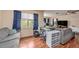 Bright living room with home office setup and wood floors at 10809 Bartolotti Loop, Seffner, FL 33584