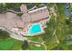 Aerial view of community pool, clubhouse, and golf course at 11021 Edge Park Dr, Hudson, FL 34667