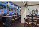 Bright and modern clubhouse bar with comfortable seating at 11021 Edge Park Dr, Hudson, FL 34667