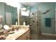 Updated bathroom with a walk-in shower, granite vanity, and elegant fixtures at 11021 Edge Park Dr, Hudson, FL 34667