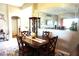 Bright dining area features a wood table and chairs, offering a space for casual meals at 11021 Edge Park Dr, Hudson, FL 34667
