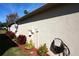 Rear exterior showing stucco wall and landscaping at 11021 Edge Park Dr, Hudson, FL 34667