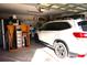 Attached garage with space for a car and storage at 11021 Edge Park Dr, Hudson, FL 34667