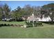 Quaint gazebo surrounded by manicured landscaping at 11021 Edge Park Dr, Hudson, FL 34667